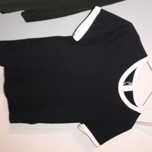 A cute black top with white tips on the sleeves•